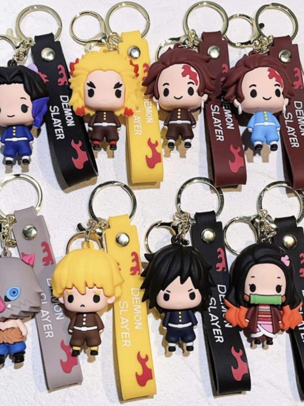 Demon Slayer: Kimetsu no Yaiba, complete with a wrist strap. B7